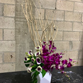 Intricate Floral Arrangement with Purple-White Roses and Branches Velene's Floral